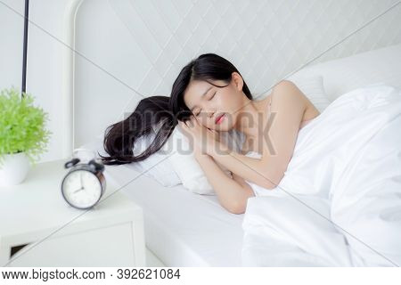 Beautiful Young Asian Woman Sleep With Relax On The Bed With Alarm Clock In The Morning, Girl Sleep 