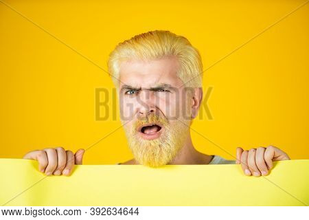 Funny Man With Blank Advertising Board On Color Background. Man Holding Big Sign Board. Copy Space F
