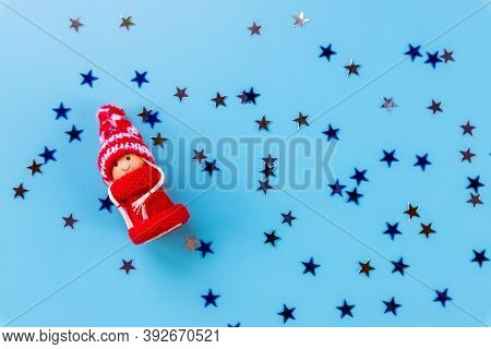 Christmas Composition With Gnome Or Swedish Tomte, On A Blue Background, Copy Space, Top View.wooden