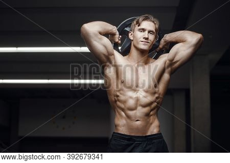 Fitness Man At Workout In Gym With Bodybar Stretching Muscles. Workout Fitness And Bodybuilding Heal