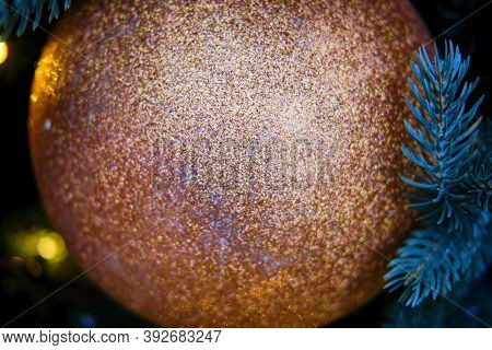 Big Golden Ball On A Blue Branch Christmas Tree, Copy Space