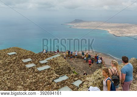 Lanzarote,canary Islands, Spain-august 31, 2018. Tourists Enjoying The View To The Island Of La Grac