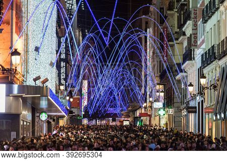 Madrid, Spain - January 4, 2020: Crowds Of People Gather At The Calle Preciados In Madrid Under The 