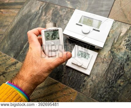 Paris, France - Oct 25, 2020: Pov Man Showing Vaillant Iot Device Devices - Vrc 700f Weather Compens