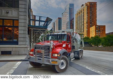 New York City, Usa, September 12, 2017 : A Red Construction Truck Turns In A Street Of Manhattan. Ma