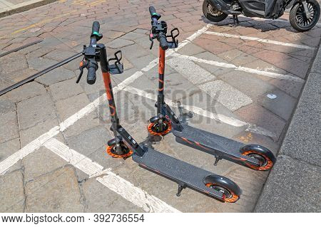 Milan, Italy - June 15, 2019: Two Rental Scooters Circ Parked At Street In Milan, Italy.