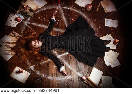 A portrait of a scary witch in the wooden house. Magic, dark force, spell. 