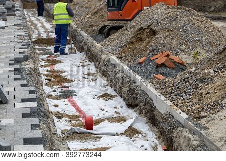 Backfill And Power Cables Installation During A Sidewalks Or Patio Reconstruction. Selective Focus.