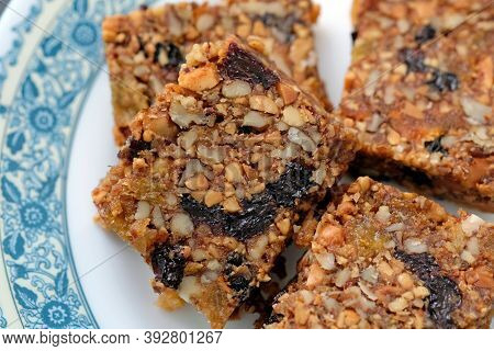 Kozinaki With Nuts, Dried Apricots, Figs And Raisins. Healthy Snack Made Of Nuts And Nougat. A Healt