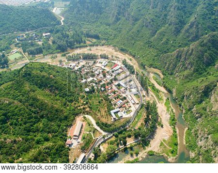 Aerial View Of Small River Running Next A Village In The Mountain, Located In Miyun, Natural Reserve
