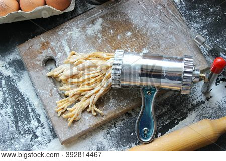 Machine For Cooking Pasta. The Dough For Pasta.metal Machine For Production Of Pasta And Ingredients