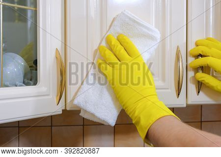 House Cleaning, Close-up Of Hands With A Rag Wiping Dust Off Furniture