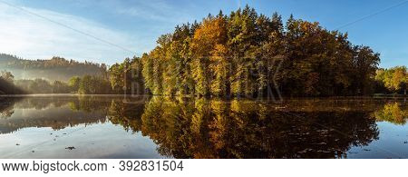 Lake Fog Landscape With Autumn Foliage And Tree Reflections In Styria, Thal, Austria. Autumn Season 