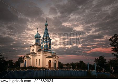 Orthodox Old Church In The Village At Sunset