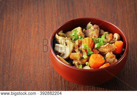 Meat Stew With Vegetable On Rustic Wooden Background