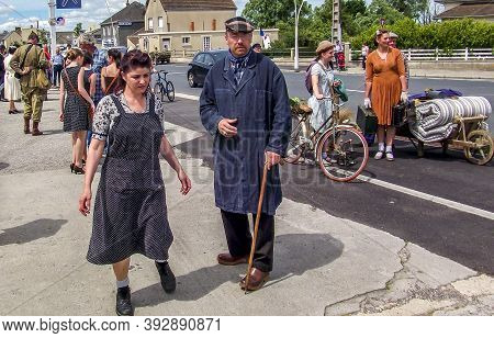Sainte Mere L'eglise, France - June 6, 2019. Parade Of People Dressed Up In 1940's Clothing Posing I