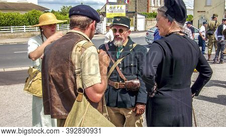Sainte Mere L'eglise, France - June 6, 2019. Parade Of People Dressed Up In 1940's Clothing Posing I