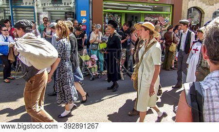 Sainte Mere L'eglise, France - June 6, 2019. Parade Of People Dressed Up In 1940's Clothing Posing I