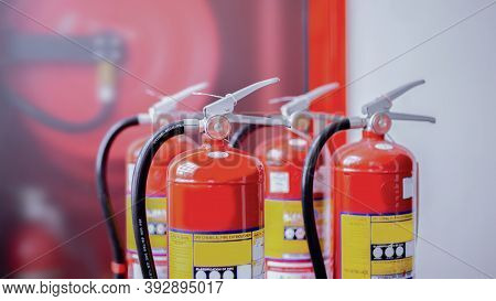 Red Fire Extinguisher Tank At The Exit Door In The Building Concepts Of Emergency Safety For Fire Pr