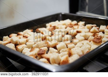Square Toasted Pieces Of Homemade Delicious Rusk, Hardtack, Dryasdust, Zwieback On A Baking Sheet.