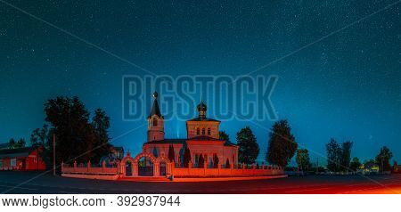 Korma Village, Dobrush District, Belarus. Comet Neowise C2020f3 In Night Starry Sky Above St. John T
