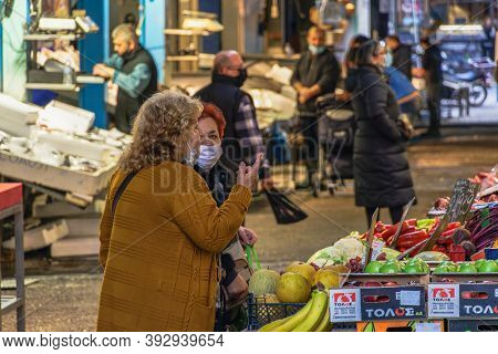 Thessaloniki, Greece - November 02 2020: People At Greengrocer Shop With Covid-19 Masks. Food Store 
