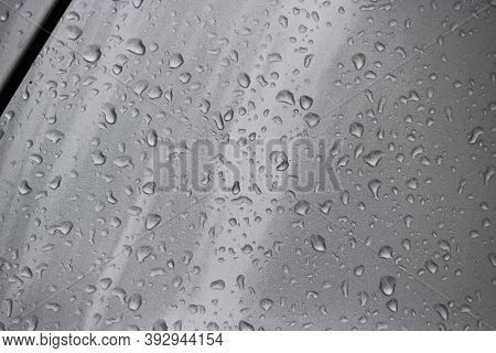 Raindrops On The Silvery Surface Of The Car. Selective Focus.