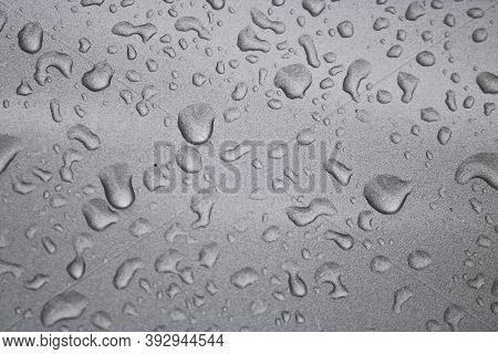 Raindrops On The Silvery Surface Of The Car. Selective Focus.
