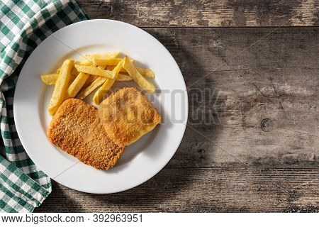 San Jacobo Steak Filled With Cheese And Ham On Wooden Table. Top View. Copy Space