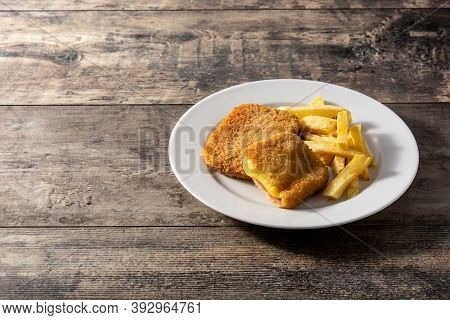 San Jacobo Steak Filled With Cheese And Ham On Wooden Table.copy Space
