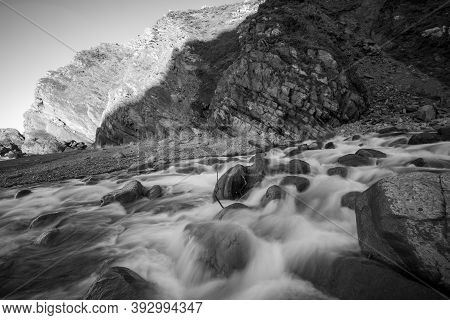 Long Exposure Of The River Heddon Flowing Onto The Beach At Heddons Mouth In Exmoor