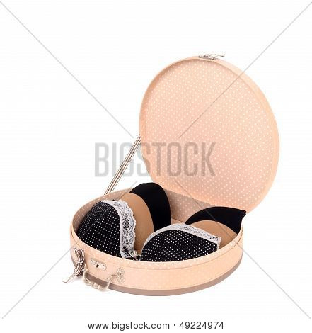 Round cute opened box with three sexy bras.