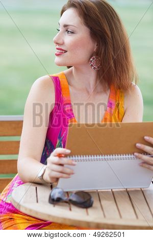 Young Lady Planning In Her Organizer