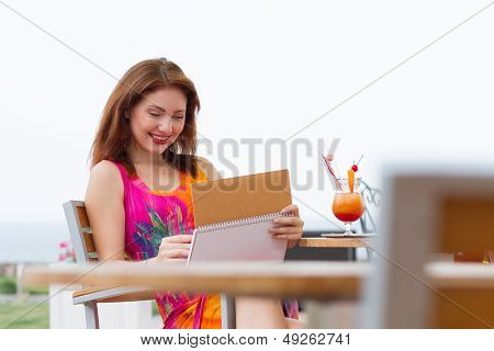 Young Lady Planning In Her Organizer