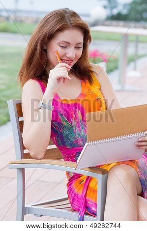 Young Lady Planning In Her Organizer