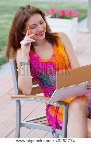 Young Lady Planning In Her Organizer