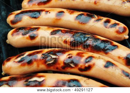 Grilling Fresh Hot Dogs Close-Up