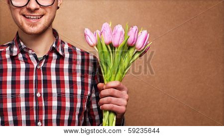 Man Clothing Hipster Holding A Bouquet Of Flowers