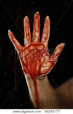 bloody hand on glass