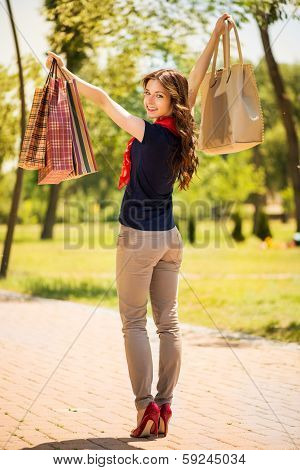 Happy girl with shopping bags