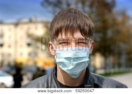 Teenager In Flu Mask