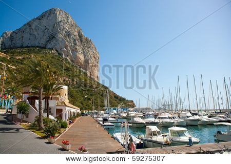 Calpe Alicante marina boats with Penon de Ifach mountain in Mediterranean sea of Spain