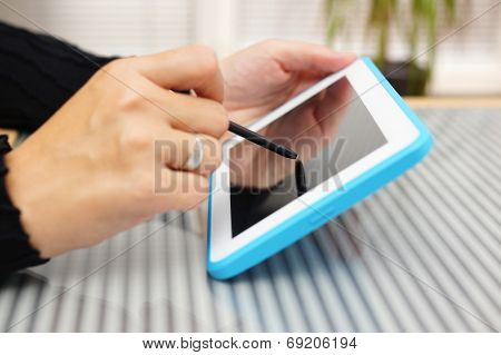 Closeup Of Woman Working With Pen On Tablet Pc
