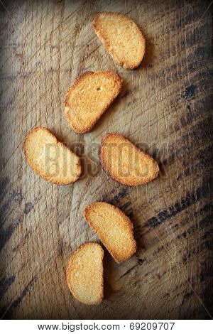 Vintage photo of rusks on wooden table