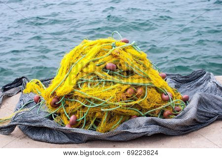 Fishing Nets In Front Of The Beautiful Port Of Nikiti Village In Greece