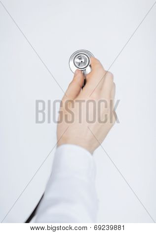 picture of doctor hand with stethoscope listening somebody