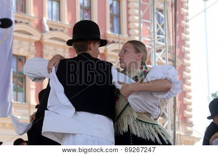 ZAGREB, CROATIA - JULY 19: Members of folk group Seljacka sloga from Donja Dubrava, Croatia during the 48th International Folklore Festival in center of Zagreb, Croatia on July 19, 2014