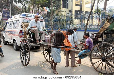 KOLKATA - FEB 15: rickshaw driver working on February 15, 2014 in Kolkata, India. Rickshaws have been around for more than a century, but they could soon be a thing of the past.
