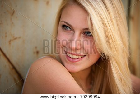 Young Blonde Caucasian Girl Alone On A Street