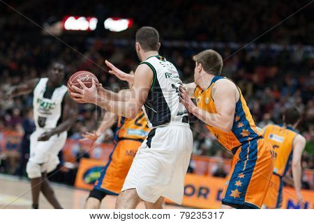 VALENCIA, SPAIN - DECEMBER 30: Suton with ball during Spanish League match between Valencia Basket Club and Juventut at Fonteta Stadium on December 30, 2014 in Valencia, Spain